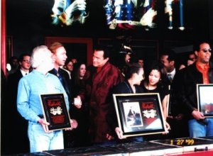 l to r:  Tim Bogert, Billy Sheehan, actor Steven Segal, James Jamerson's widow and daughter, Stanley Clarke. In bachground Bootsy Collins & Larry Graham